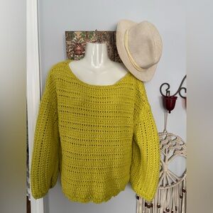 Anthropology knit sweater with semi- loose weave.